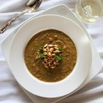 A bowl of spicy Caribbean peanut vegetable soup.